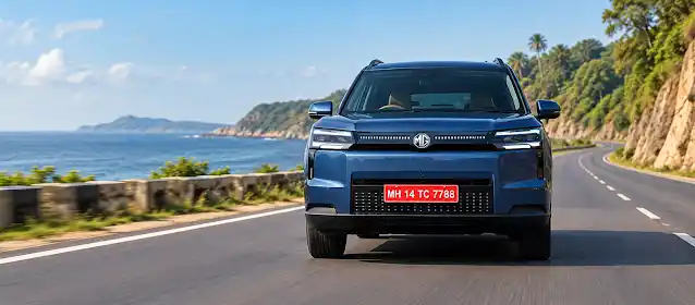 MG Hector Tomahawk EV Review electric SUV driving on coastal highway front view