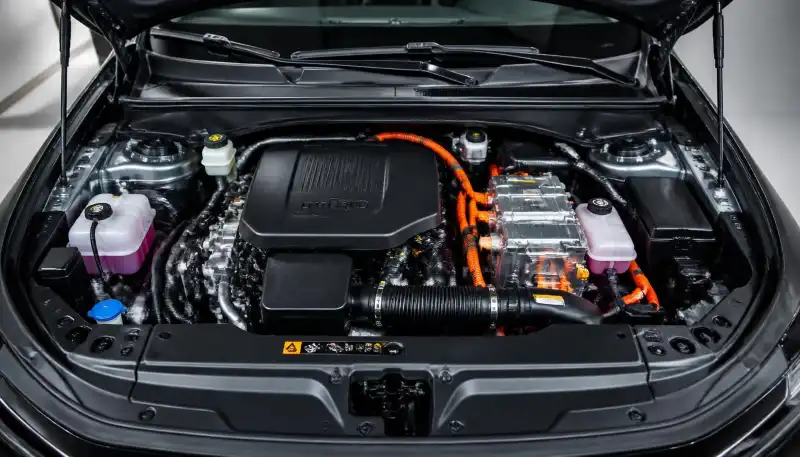 MG Hector Tomahawk PHEV 1.5L petrol hybrid engine bay with orange high voltage cables